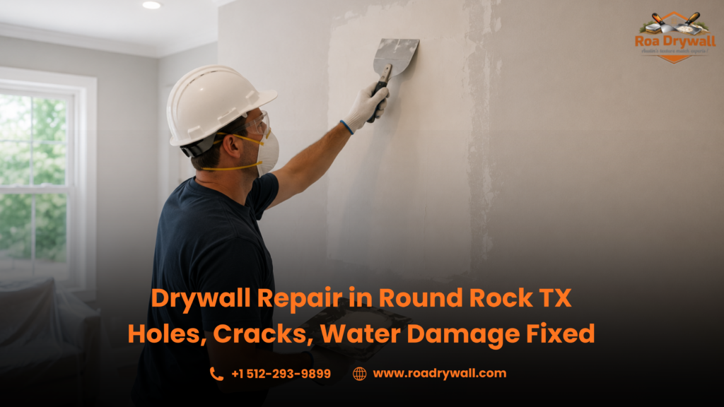 "Professional drywall technician wearing a hard hat, safety goggles, gloves, and a dust mask while applying joint compound to repair a drywall patch inside a residential room. The image promotes drywall repair services in Round Rock, Texas, including repairs for holes, cracks, and water-damaged walls.